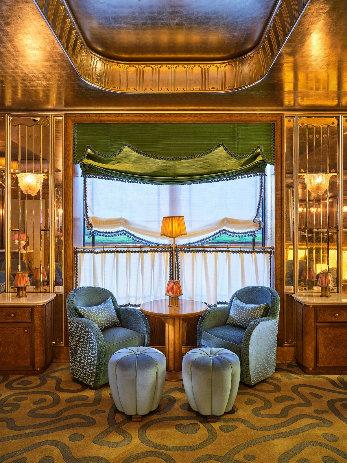 seating niche in the Vesper Bar at The Dorchester with gold and velvet details